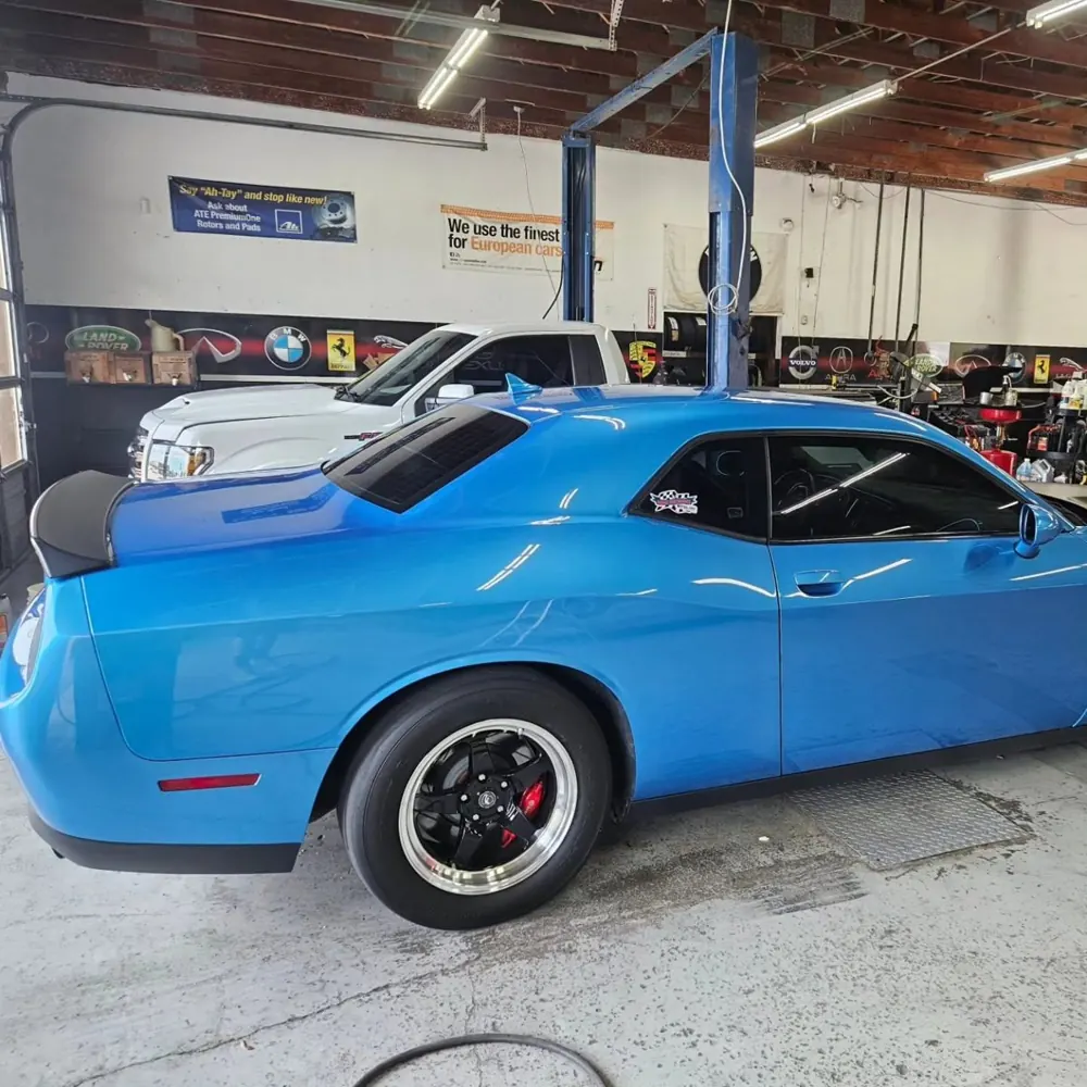 Blue Dodge Challenger, side and rear