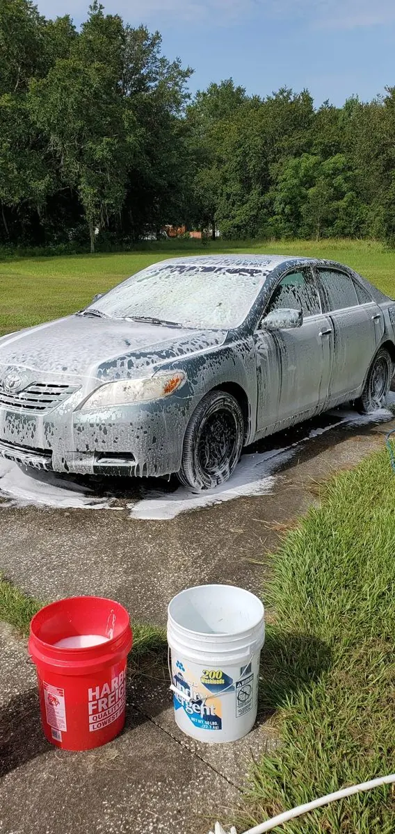 Sedan covered in wash foam